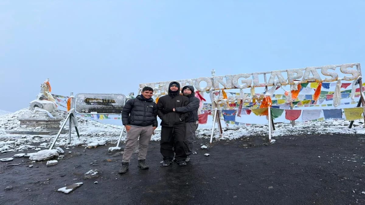 Trekkers at Thorong La Pass, 5,416m, on the Manaslu and Annapurna Circuit combined trek