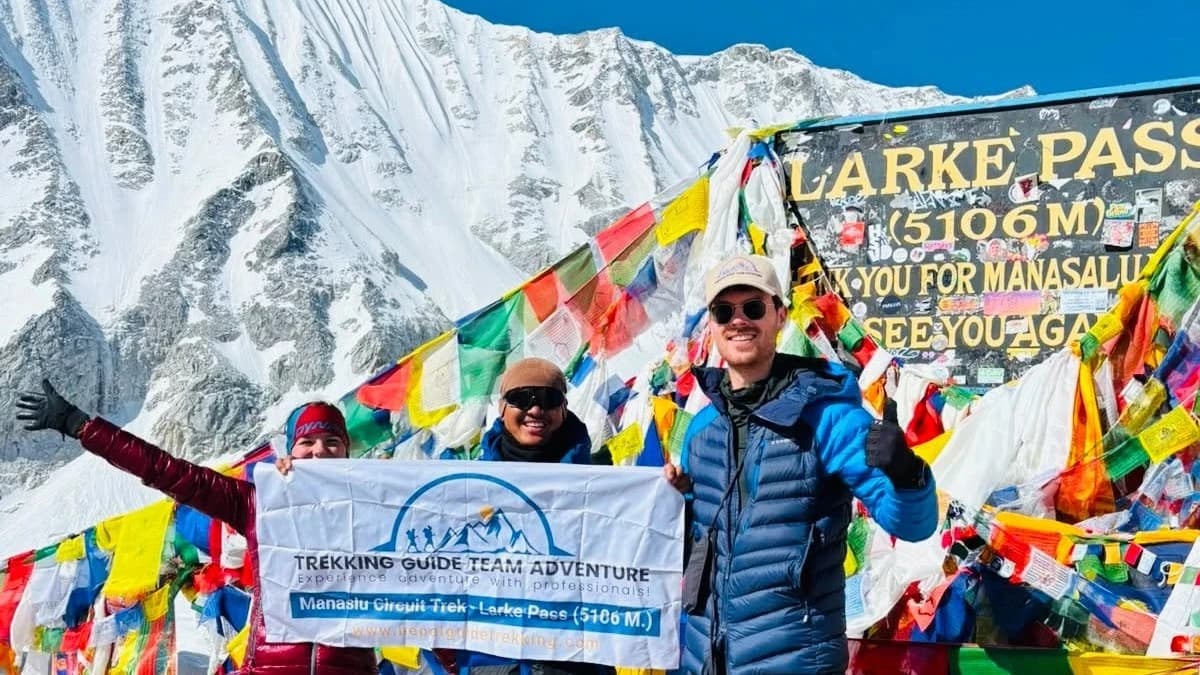 Trekkers celebrating at Larke Pass (5,106m), the highest point of the Manaslu Circuit Trek